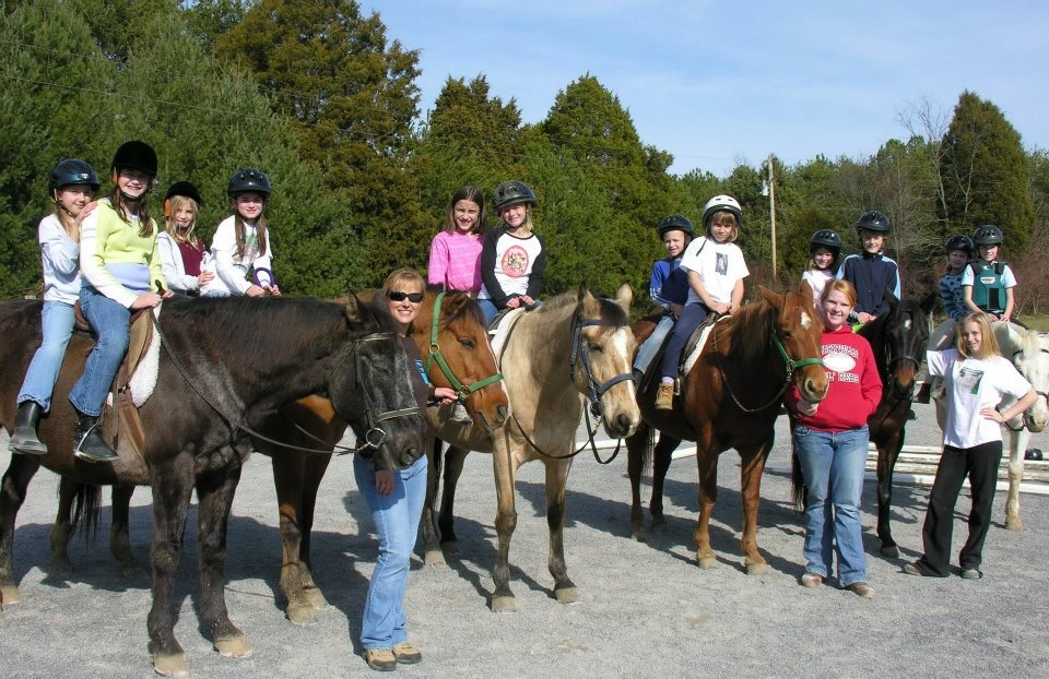 Summer camp kids riding horses at Young Mountain farm and mountain magic camp